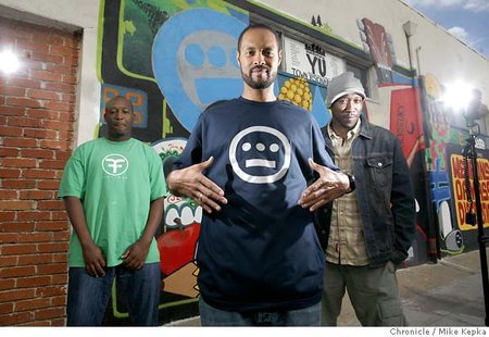 Tajai Massey (center), with artists Pep Love (left) and Prince Ali, is the chief executive of Hiero Imperium in Oakland. Chronicle photo by Mike Kepka