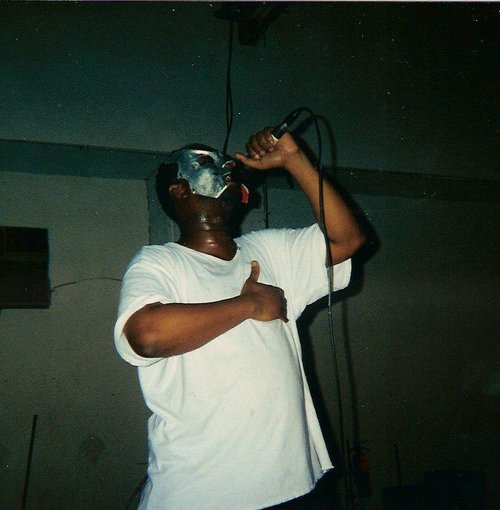 He hold his heart when he tellin rhymes. MF Doom at gig with Jedi Mind Tricks at 4040 (aka Stalag 2000). Photo by http://www.flickr.com/photos/cullenstalin/